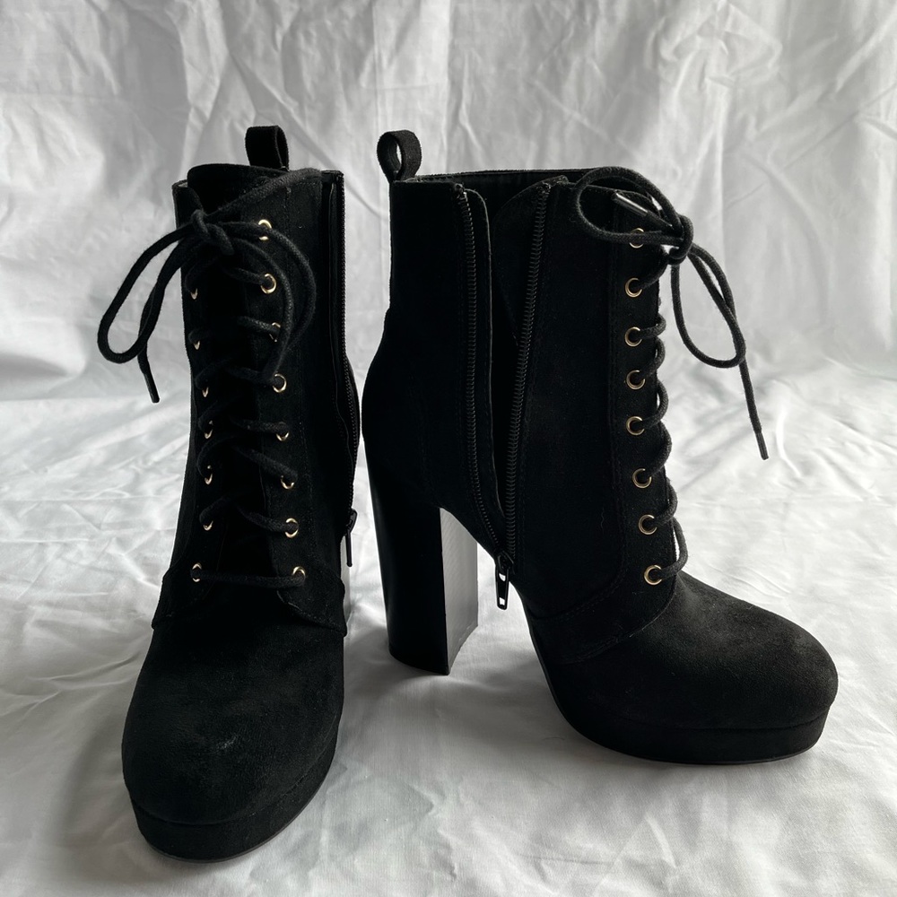 High heel boots. Black, zip up.